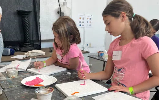 a few young girls painting