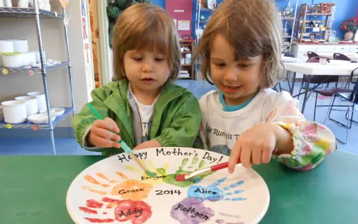 a couple of kids painting