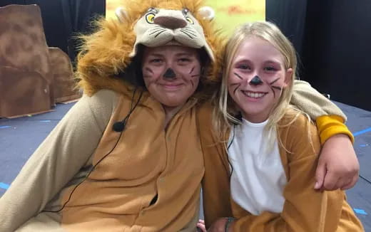 a couple of girls wearing clothing