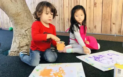 a couple of girls painting