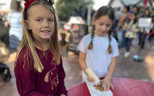 a few young girls at a street market