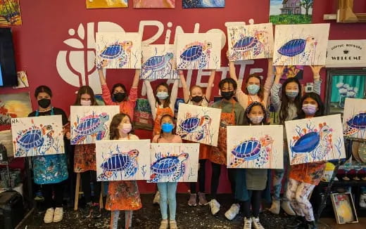 a group of children holding signs