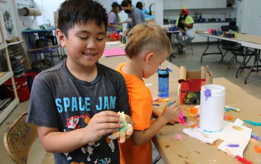 a couple of boys playing with toys