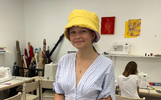 a person wearing a yellow hat