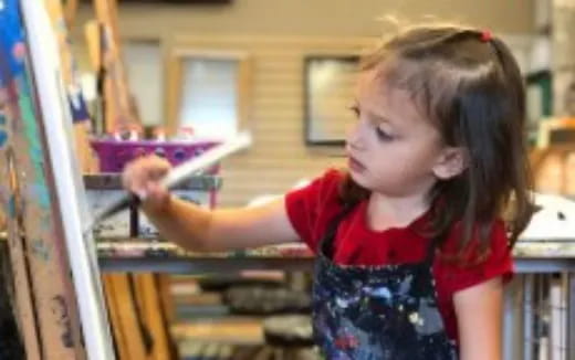 a young girl painting