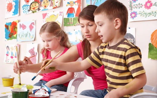 a group of children painting