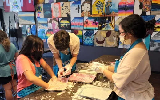 a group of people painting