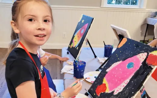 a young girl painting