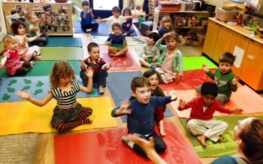 a group of children sitting on the floor
