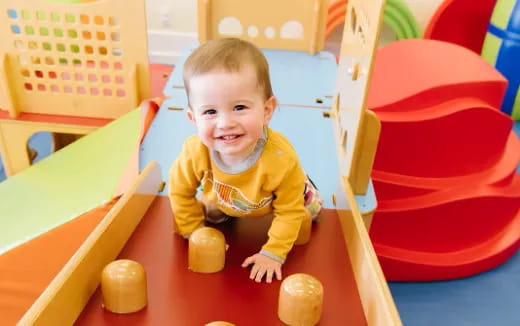 a baby playing with toys