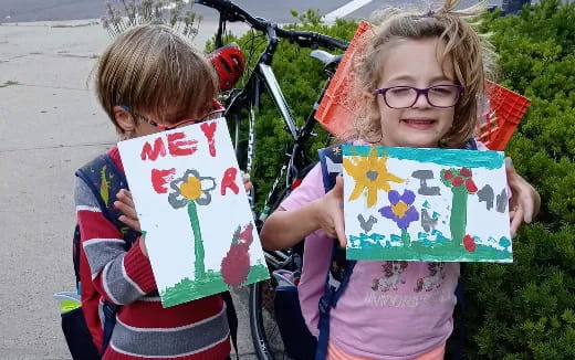 a couple of children holding flags