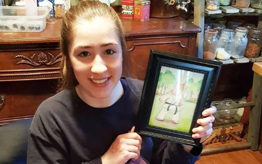 a girl holding a picture