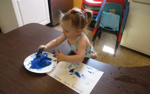 a little girl eating cake