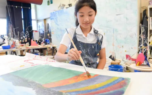 a young girl painting