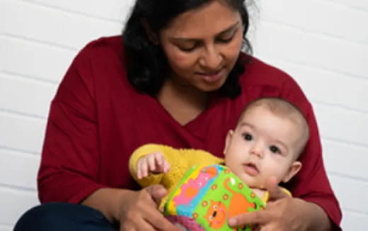 a person holding a baby