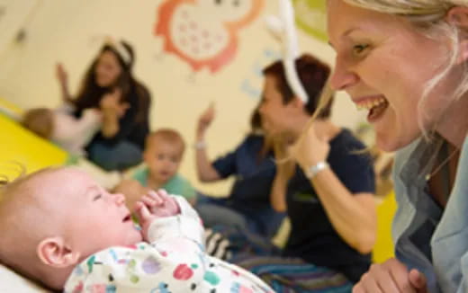 a woman holding a baby