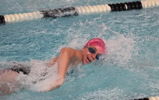 a person swimming in a pool