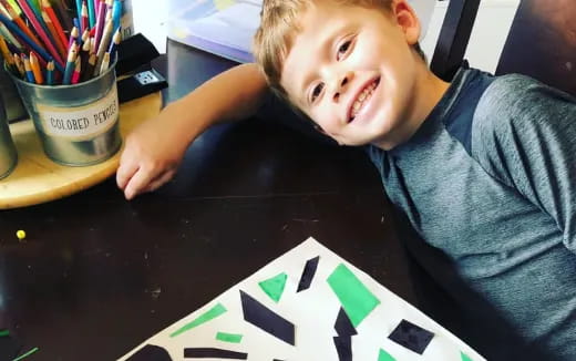 a boy sitting at a table