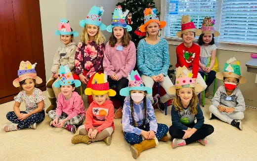 a group of children wearing hats