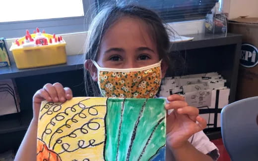 a girl holding a sign