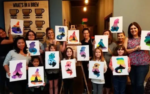 a group of people holding up posters