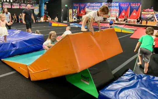 a group of people playing on a trampoline