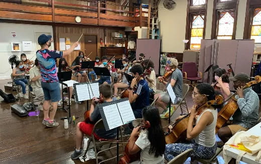 a group of people playing instruments