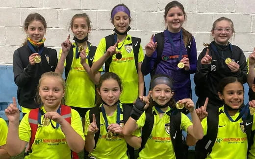 a group of people wearing medals