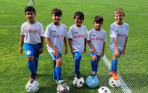 a group of boys in football uniforms