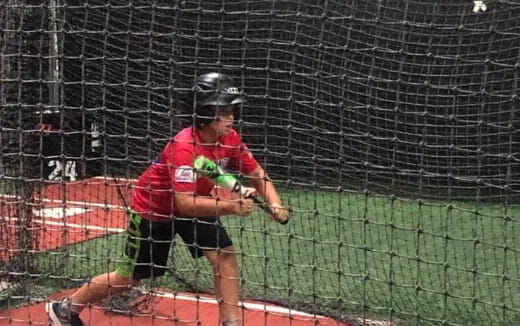 a man swinging a baseball bat