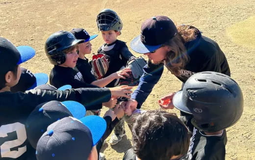 a person helping a group of kids