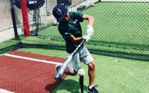 a person swinging a baseball bat