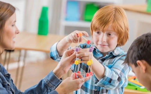 a child holding a toy