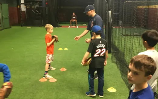 a group of kids playing baseball