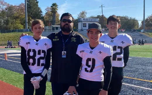 a group of people posing for a photo