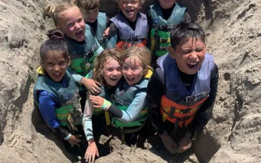 a group of children in a cave