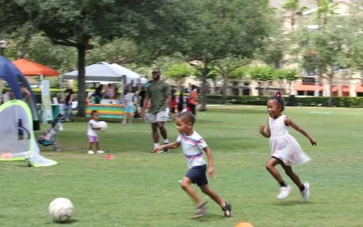 kids chasing a football ball
