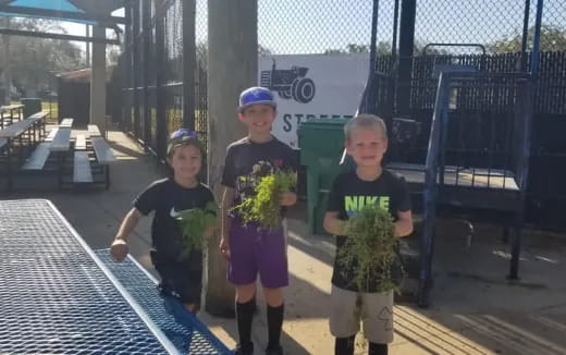 a group of children holding flowers