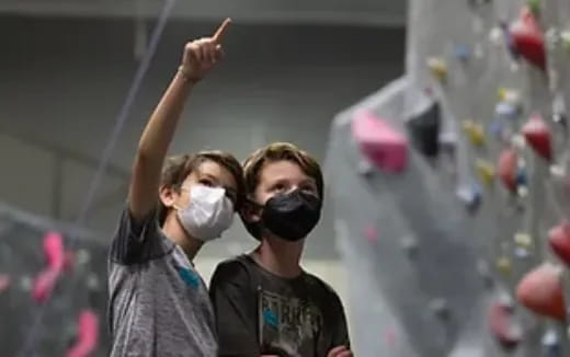 a couple of people wearing masks