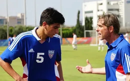 a group of men in sports uniforms