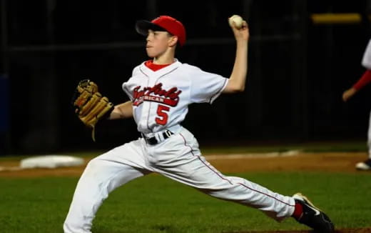 a baseball player throwing a ball