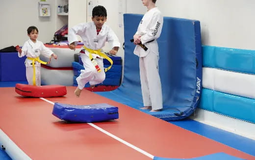 a group of people in karate uniforms