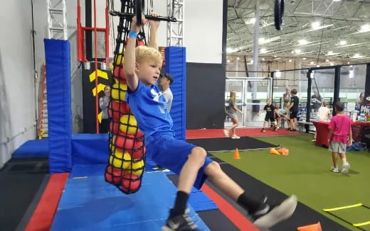 a boy lifting weights