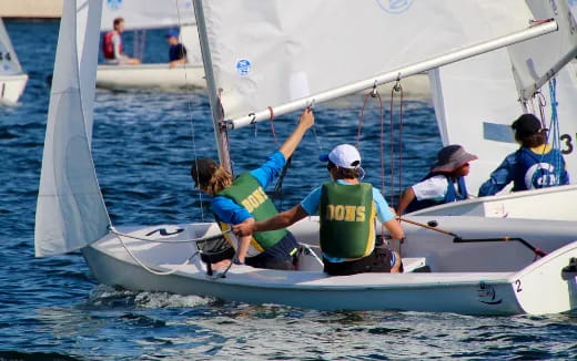 a group of people on a sailboat