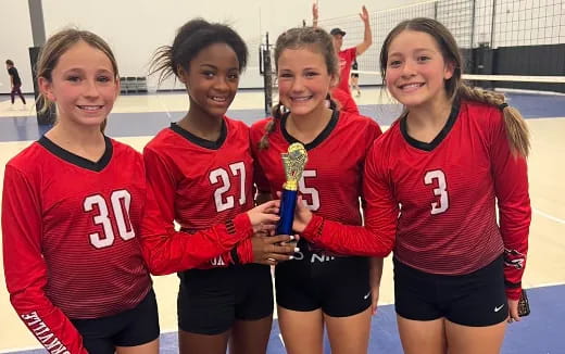 a group of girls in red shirts