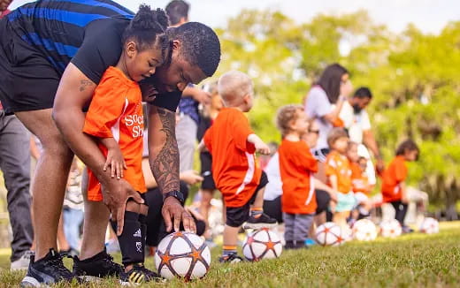 a group of kids playing football