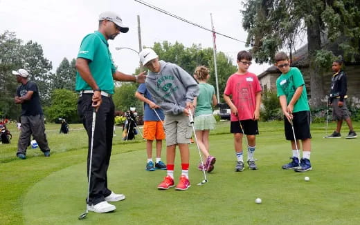 a group of people playing golf