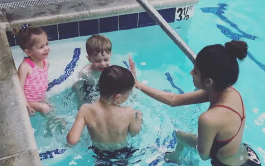 a group of children in a pool