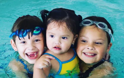 a group of children in a pool