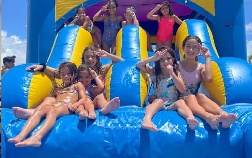 a group of people in a water slide